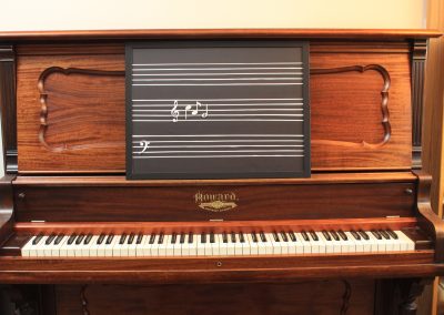 Magnetic staff board on upright piano